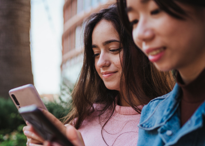 Two women looking at their phones