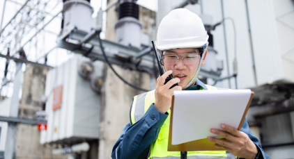 Construction worker talking on a walkie-talkie