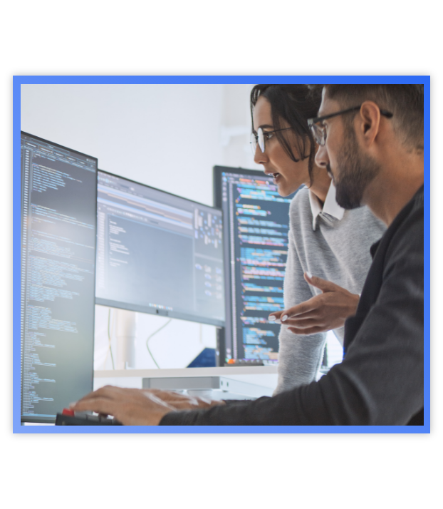 man and woman looking at computer code on verticial computer screen