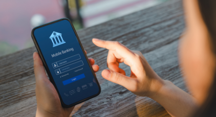 Woman banking on her mobile phone