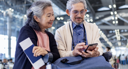 Man and woman looking at his cell phone